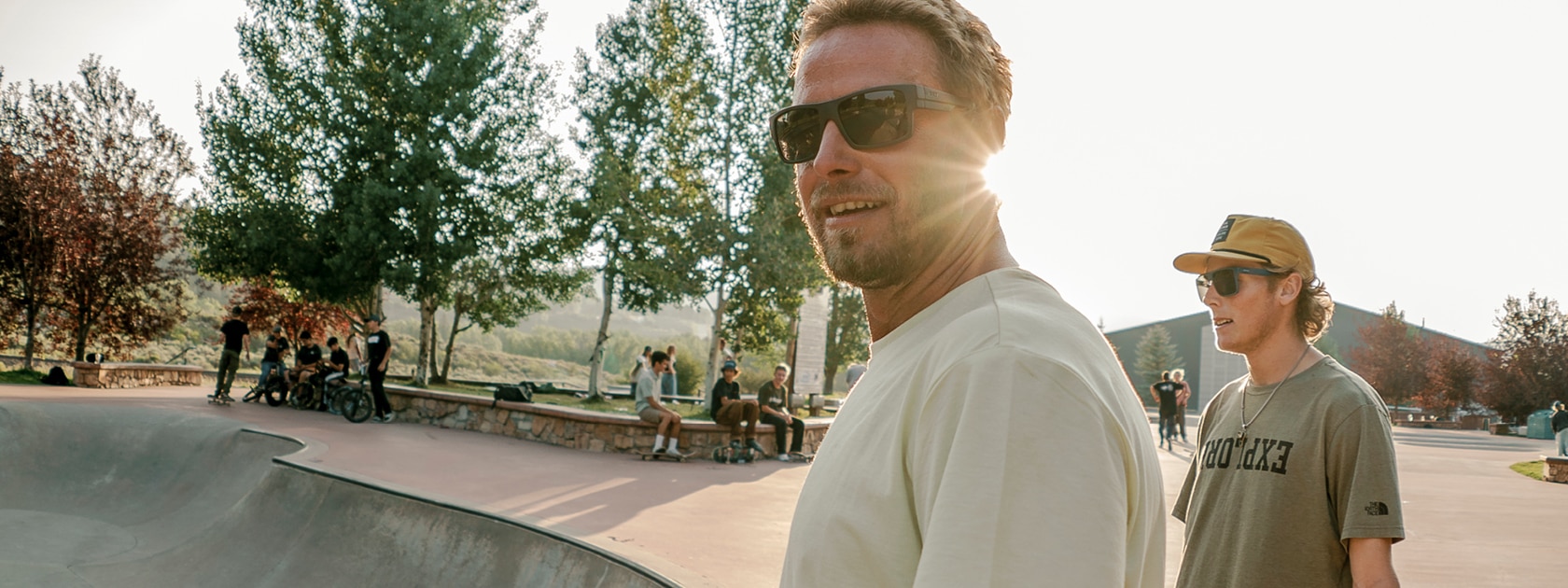 man wearing polarized sunglasses at a skate park