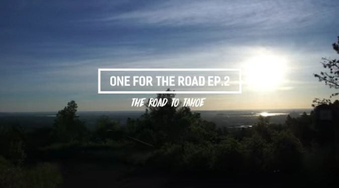 Sunny sky over a green treeline with “One For the Road Ep 2” logo over it
