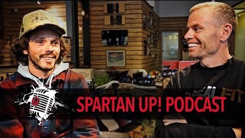 Two men smiling next to each other in the Zeal store with the Spartan Up! Podcast logo along the bottom