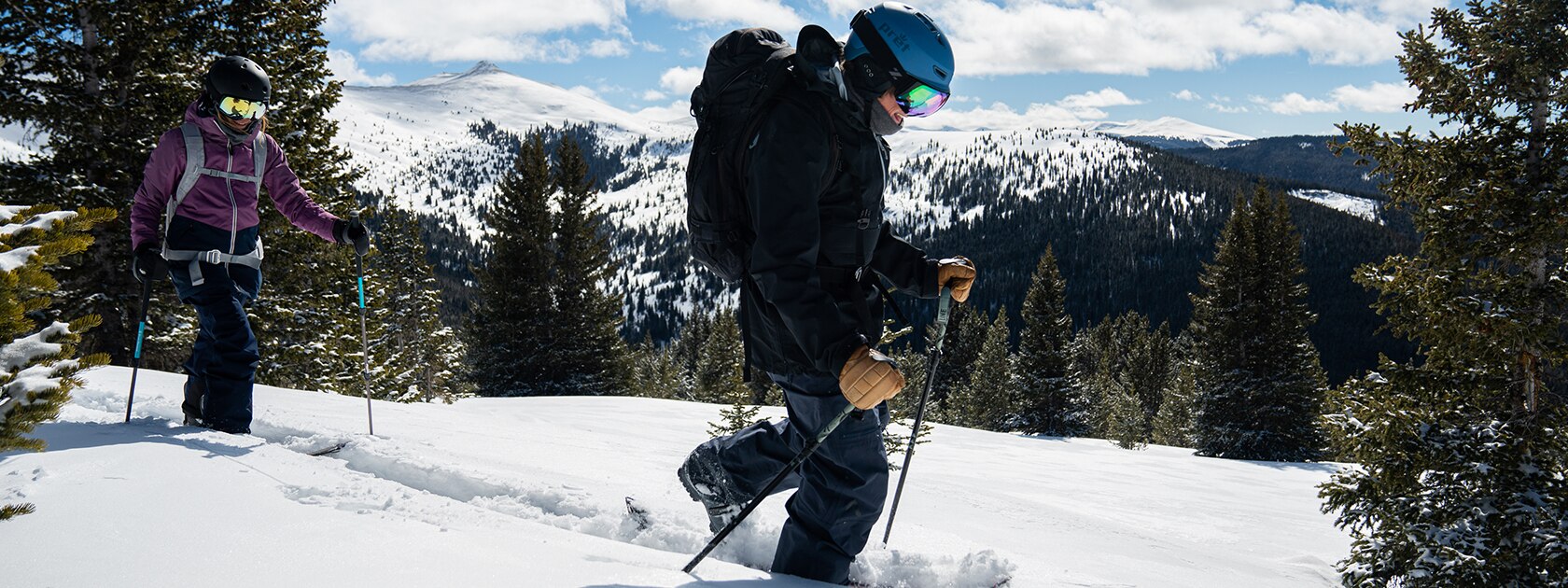 image of 2 people ski touring wearing zeal goggles