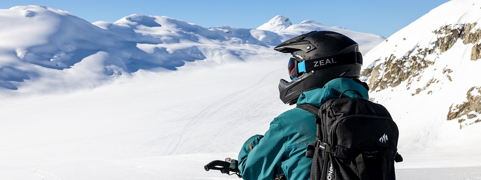 image of man wearing zeal snowmobiling goggles from side profile highlighting tpu outrigger